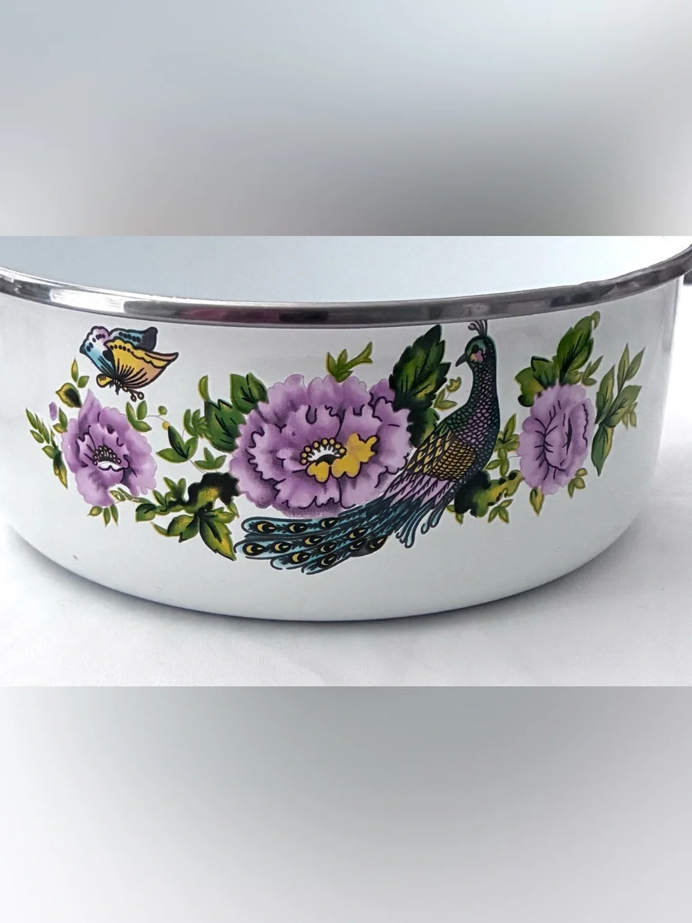 Vintage enamel mixing bowls featuring peacock and floral pattern